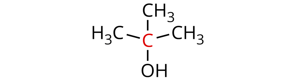 Ilustracja przedstawiająca wzór cząsteczki dwa-metylopropan-dwa-olu. Atom węgla zaznaczony na czerwono łączy się z grupą hydroksylową O H oraz trzema grupami metylowymi C H indeks dolny, trzy, koniec indeksu dolnego.  