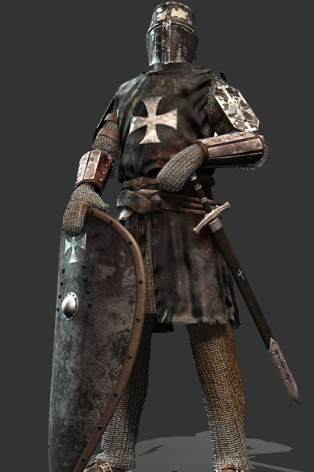 Zdjęcie przedstawia strój rycerza a epoki średniowiecza. Rycerz ma na głowie zabudowany hełm z niewielkimi otworami na oczy w kształcie szparek. Pod elementami stroju widać kolczugę, czyli pancerz. Na nią założone są pozostałe elementy stroju: naramienniki, zarękawia, fartuch z krzyżem oraz pas z przytroczonym mieczem. Rycerz trzyma tarczę z krzyżem opartą o podłoże. The picture shows the costume of the knight and the era of the Middle Ages. The knight has a built-in helmet on his head with small openings in the shape of stomata. Under the elements of the outfit you can see a mail coat or armor. The other elements of the outfit are worn on it: arm-shells, zaręawia, apron with a cross and a belt with a sword strapped. The knight is holding a shield with a cross resting on the ground.