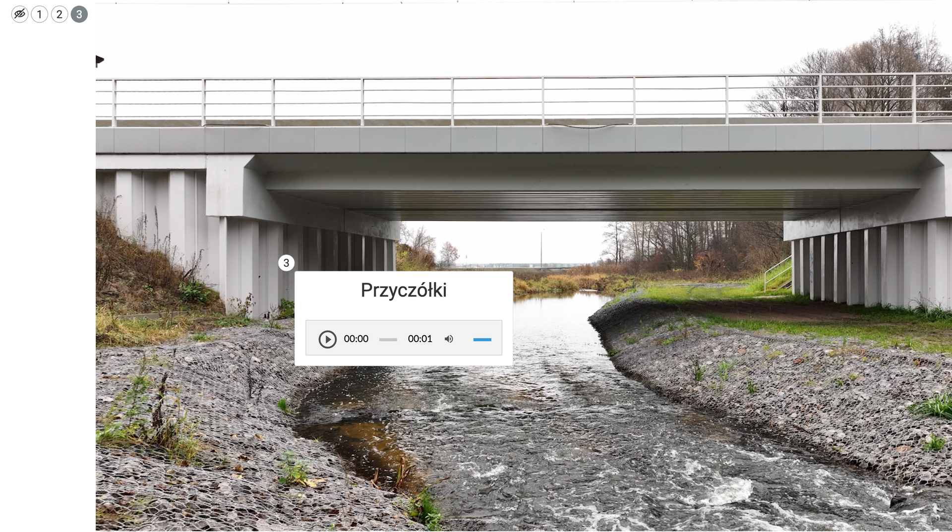Zrzut ekranu przedstawia przykładowy opis elementu w atlasie. Pokazany jest fragment ilustracji interaktywnej. Znajduje się na niej punkt klikalny 2, do którego zaczepiony jest dymek z tekstem.