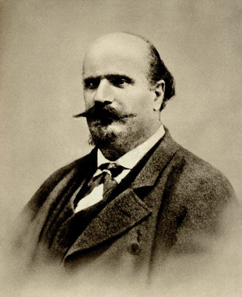 Ilustracja przedstawia: Temistocle Solera, włoski librecista współpracujący z Verdim. Fotografia z 1860 roku. Mężczyzna w średnim wieku jest elegancko ubrany, ma charakterystyczny zarost z wąsem i łysiejące czoło.