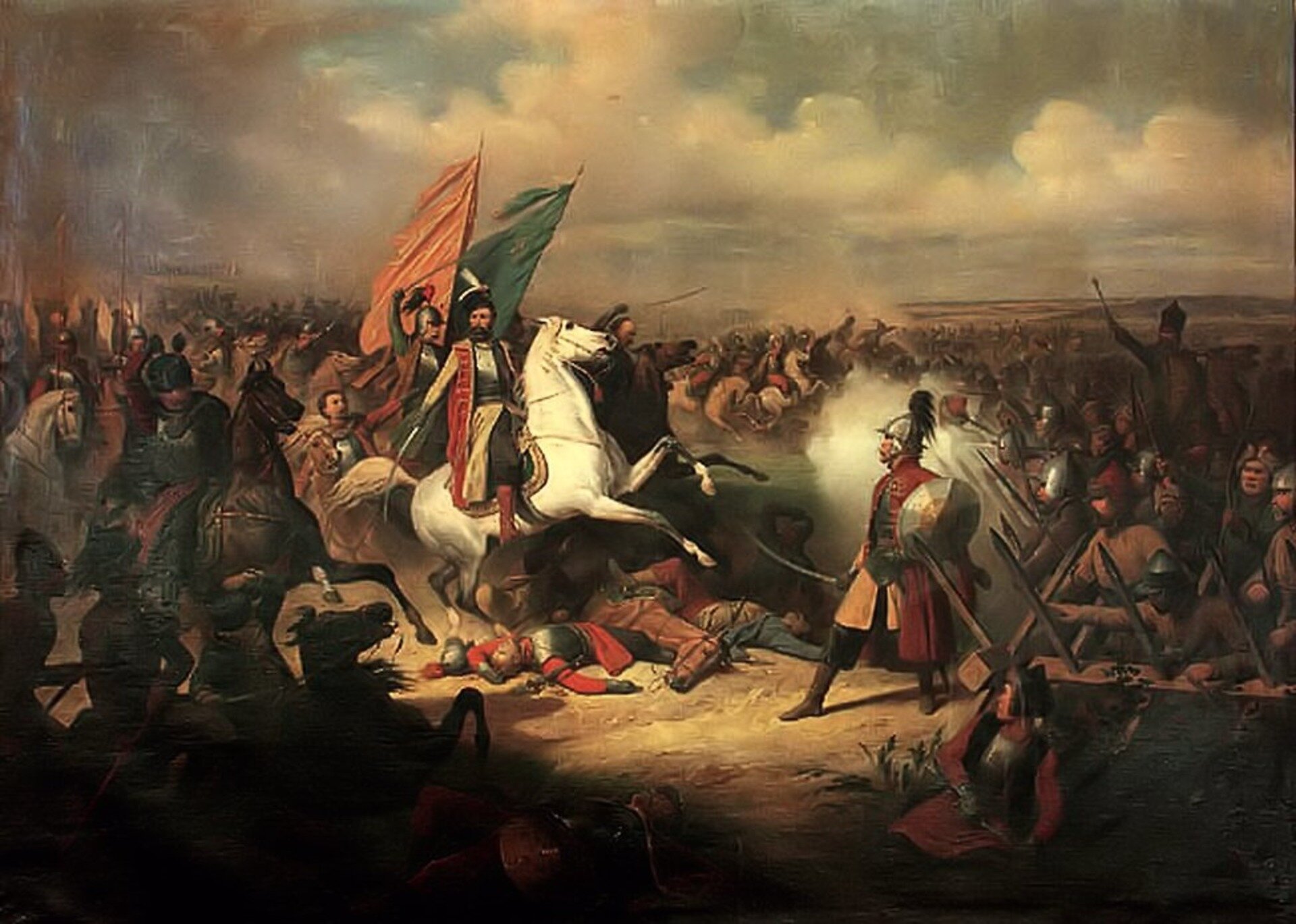 Obraz przedstawiający postać Hetmana Stefana Czarnieckiego na polu bitwy. Wokół żołnierzy Hetman siedzi na białym koniu. W tle, na wietrze powiewają chorągwie. 