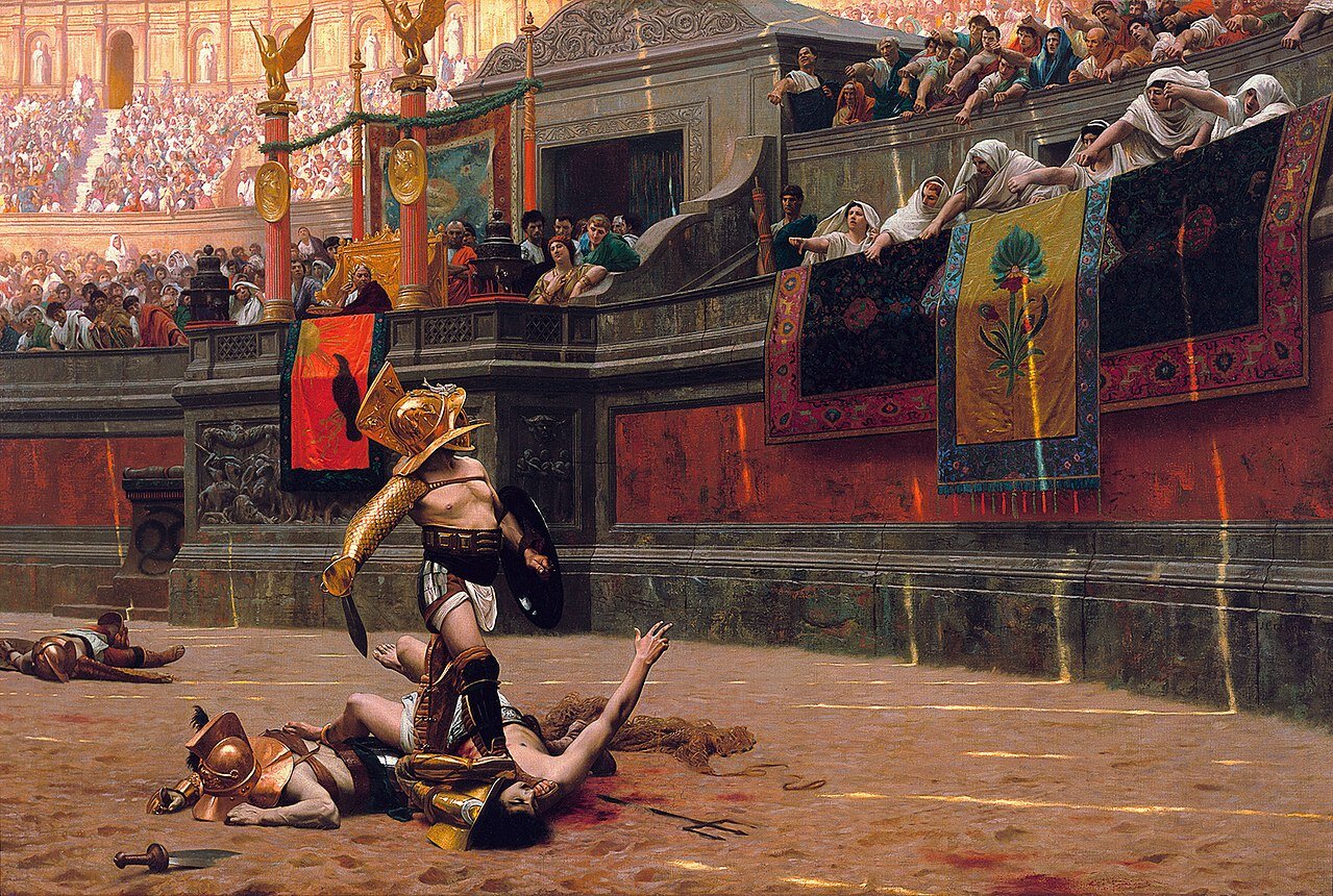 Ilustracja przedstawia arenę walk gladiatorów, która otoczona jest wysokimi trybunami zapełnionymi wiwatującymi ludźmi. Na piasku widać gladiatora z hełmem na głowie, mieczem i tarczą, który jedną nogą przyciska do ziemi półnagiego mężczyznę. Gladiator spogląda w górę na tłum. Wokół widać leżące ciała innych gladiatorów.