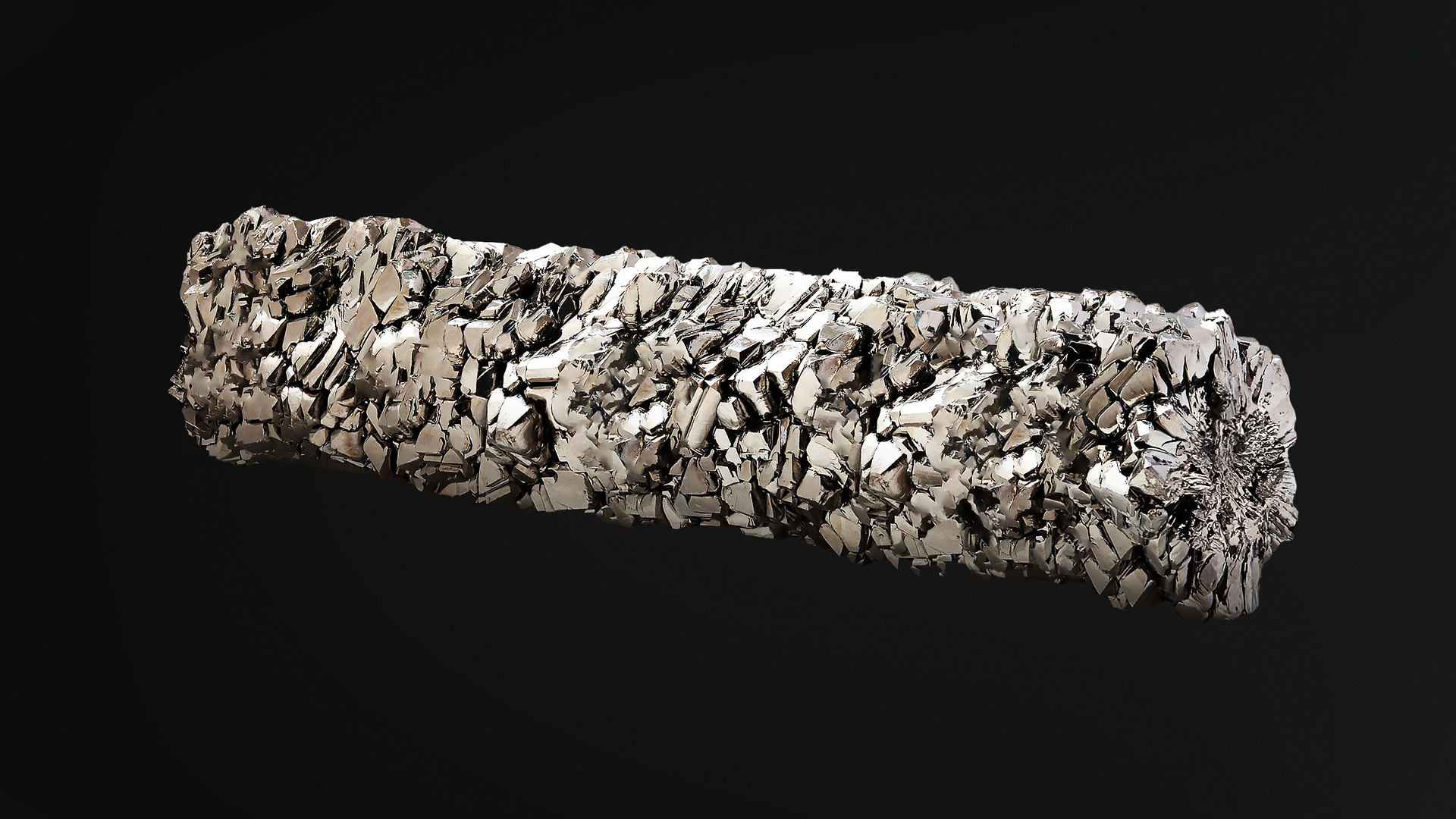 Na grafice przedstawiono pręt tytanu. Jest to lekki metal o szarawym kolorze. W jego strukturze wyraźne są ubytki.