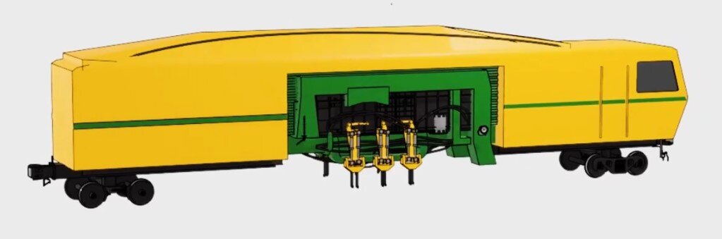 Ilustracja przedstawia podbijarkę uniwersalną, inaczej rozjazdową. Wyposażona jest w dwa wózki jezdne, po dwie osie na wózek. W środkowej części znajdują się urządzenia które są odpowiedzialne za podniesienie oraz podbicie toru.