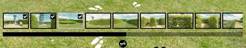 Przycisk oraz lista miejsc dostępnych w wycieczce. Na tle ekranu przedstawiającego fragment zielonego trawnika znajduje się dziewięć miniaturek zdjęć. Osiem z nich ma czarne ramki, natomiast czwarta od lewej ma ramkę szarą. Pod miniaturkami znajduje się długi pasek, w połowie czarny, w połowie szary. Pod nim czarne kółko z trzema białymi kwadracikami przekreślonymi białą linią. Na tle trawnika widać białe ślady stóp.