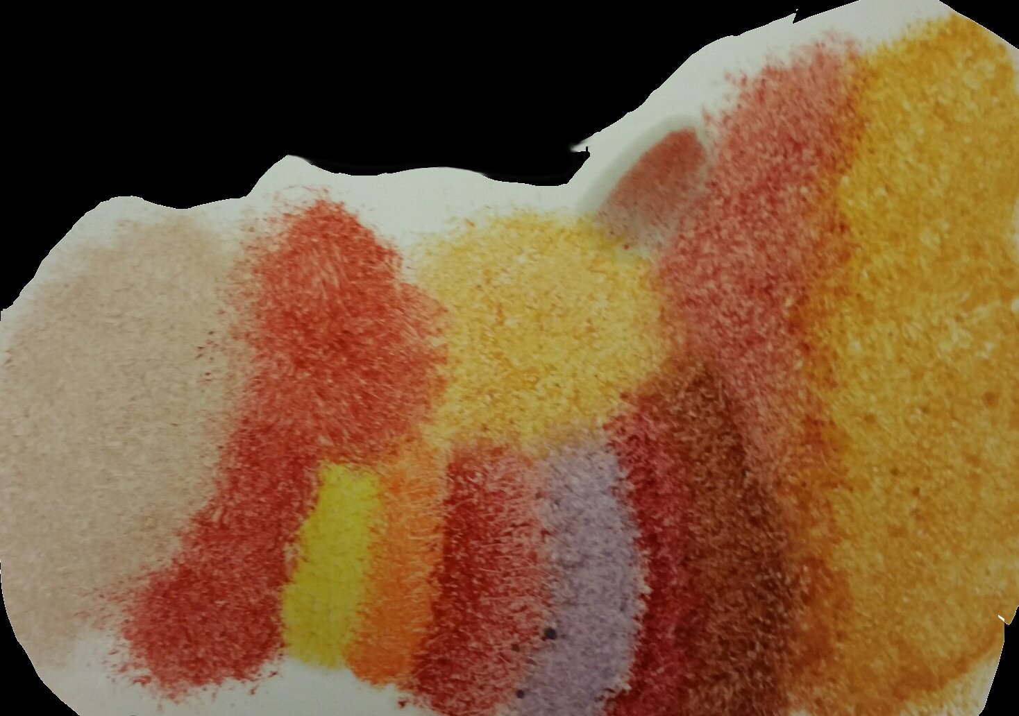 Obraz przedstawia abstrakcyjny, wielokolorowy kształt wykonany z wosku.