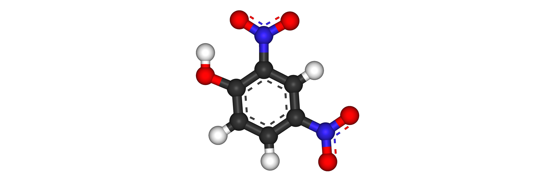 Na ilustracji jest model cząsteczki 2,4-dinitrofenolu: sześcioczłonowy pierścień zbudowany z sześciu czarnych kulek łączy się na górze oraz na dole po prawej stronie z niebieską kulką, która łączy się z dwiema czerwonymi kulkami. Czarna kulka leżąca po lewej stronie u góry pierścienia łączy się z czerwoną kulką, która łączy się z białą kulką. Każda z pozostałych czarnych kulek łączy się z białą kulką.  