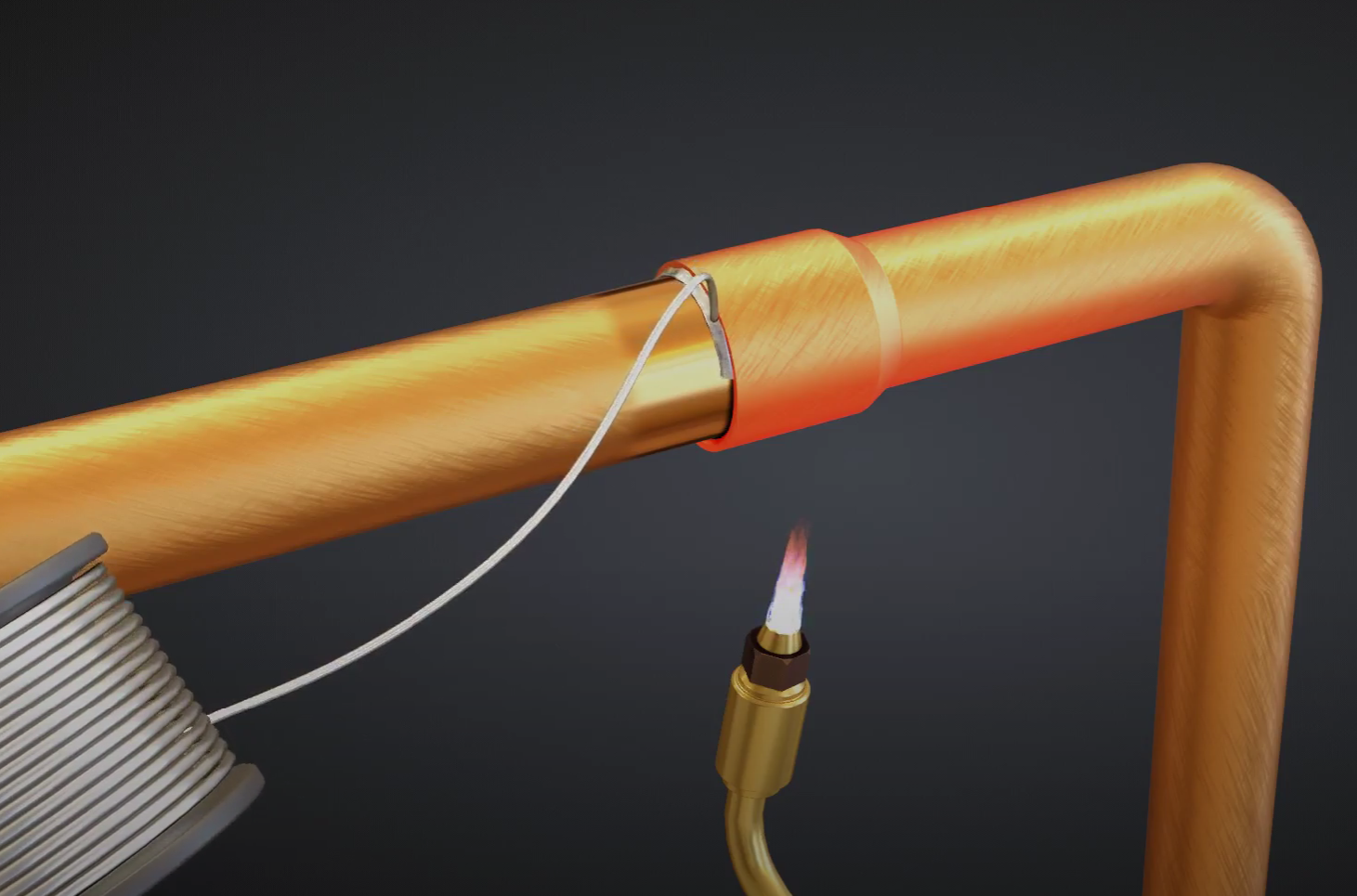 Grafika przedstawia dwie rury miedziane łączone metodą lutowania twardego przy użyciu palnika gazowo‑powietrznego, który ogrzewa płomieniem od dołu łączone rury. Pod wpływem płomienia rozgrzewa się topnik, którego zadaniem jest połączenie lutowanych rur. Topnik rozwijany jest ze szpuli.