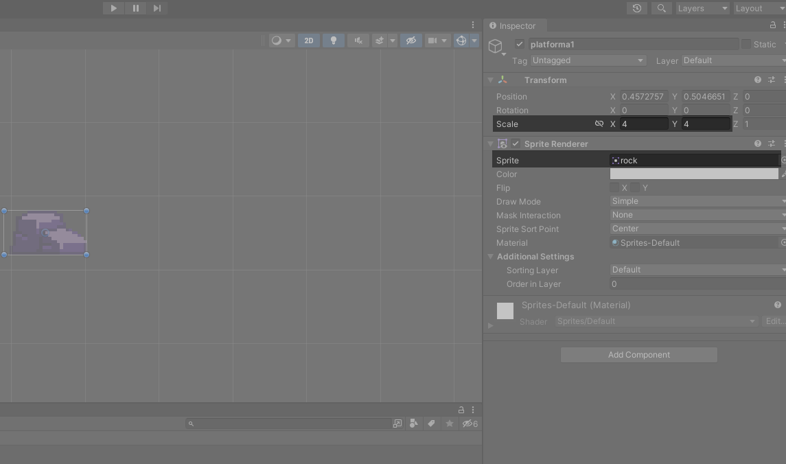Ilustracja przedstawia obszar gry. Po lewej stronie zaznaczono Scale X4, Y4 oraz Sprite rock. W polu edycji są dwa filetowe elementy przypominające stosy. Są otoczone prostokątem z punktami, dzięki którym można powiększyć element.   