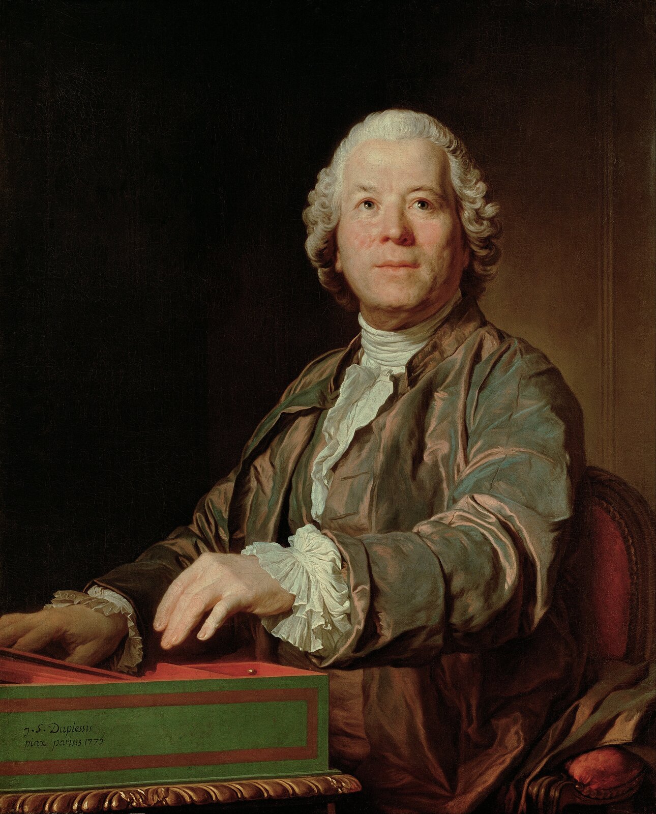 Ilustracja przedstawia dzieło Joseph Duplessis pt. Christopha Willibalda Gluck. Mężczyzna siedzi przy stoliku, ubrany jest w brązowy frak i białą koszulę. Włosy ma dłuższe, lekko podkręcone. Patrzy ku górze, ma przyjazny wyraz twarzy.