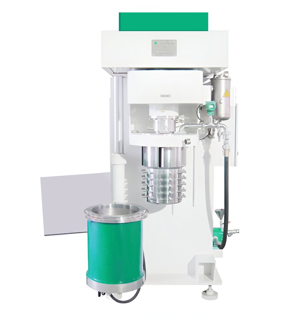 Na grafice przedstawiony jest dyspergator do przygotowania mieszanek powlekających. Urządzenie posiada pojemnik, a nad nim wałek z wypustkami.