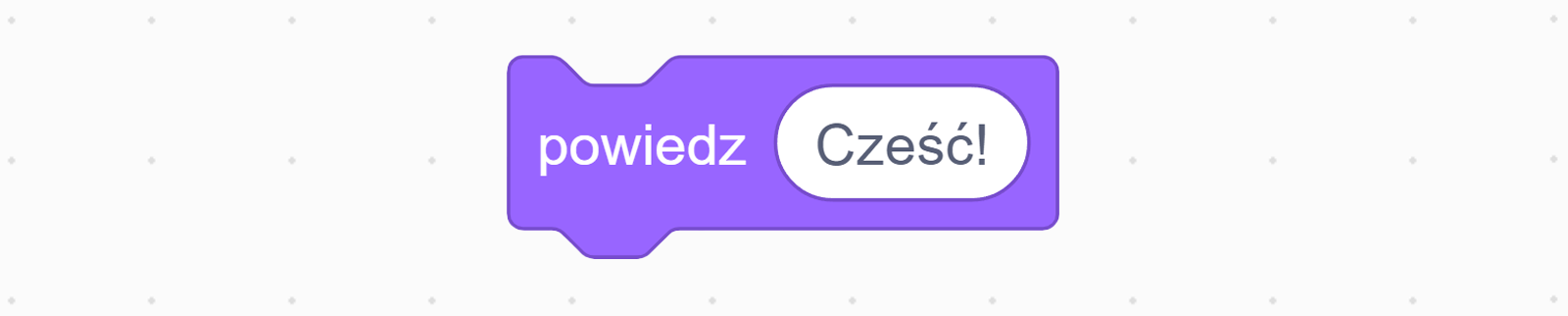 Na ekranie znajduje się fioletowy klocek z komendą 'powiedz', obok w białym polu jest napis 'Cześć!'.