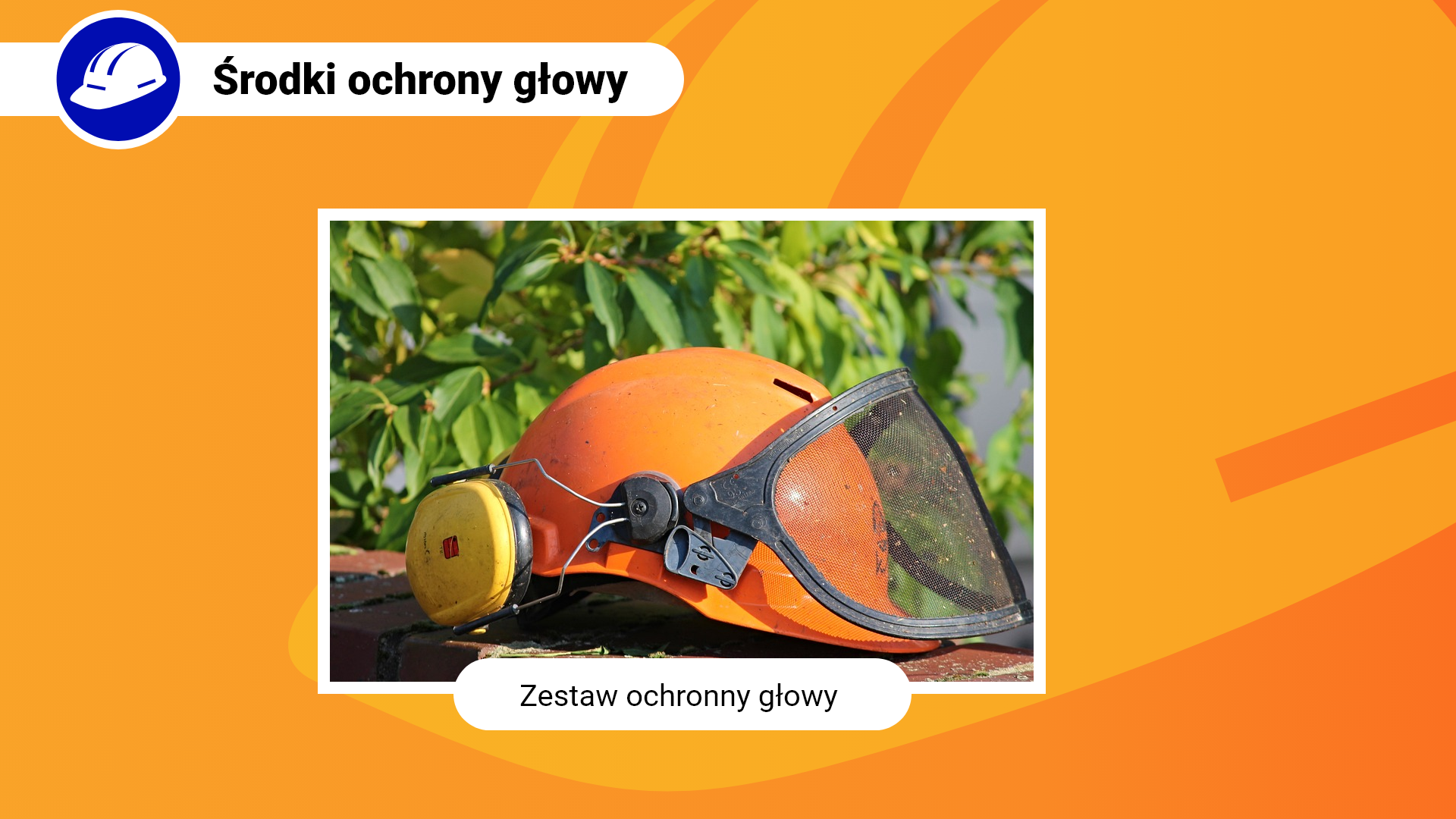 Zdjęcie w ramce z podpisem: zestaw ochronny głowy. Przedstawia zbliżenie na pomarańczowy hełm, do którego przytwierdzona jest opuszczana siatka chroniąca oczy oraz nauszniki przeciwhałasowe na uszy.