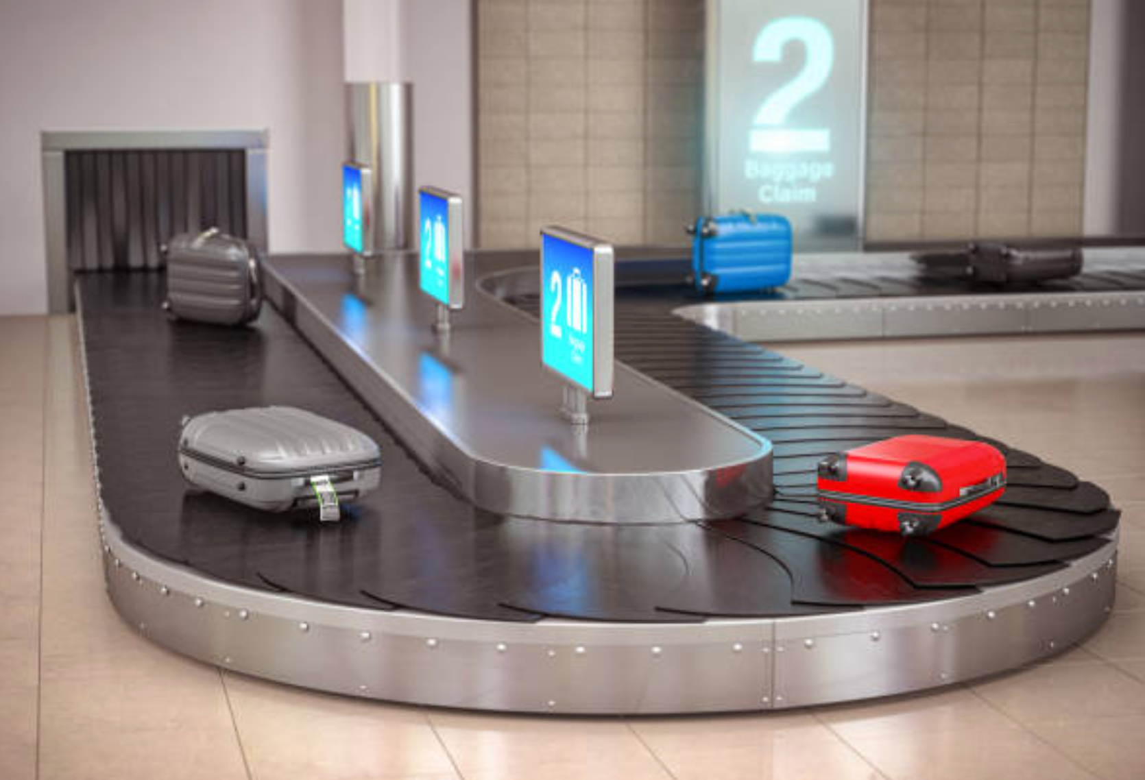 Zdjęcie przedstawia taśmociąg bagażowy. Wychodzi on prostopadle ze ściany i po paru metrach zawraca, po czym biegnie przy ścianie równolegle do niej. Na taśmociągu znajduje się kilka walizek.