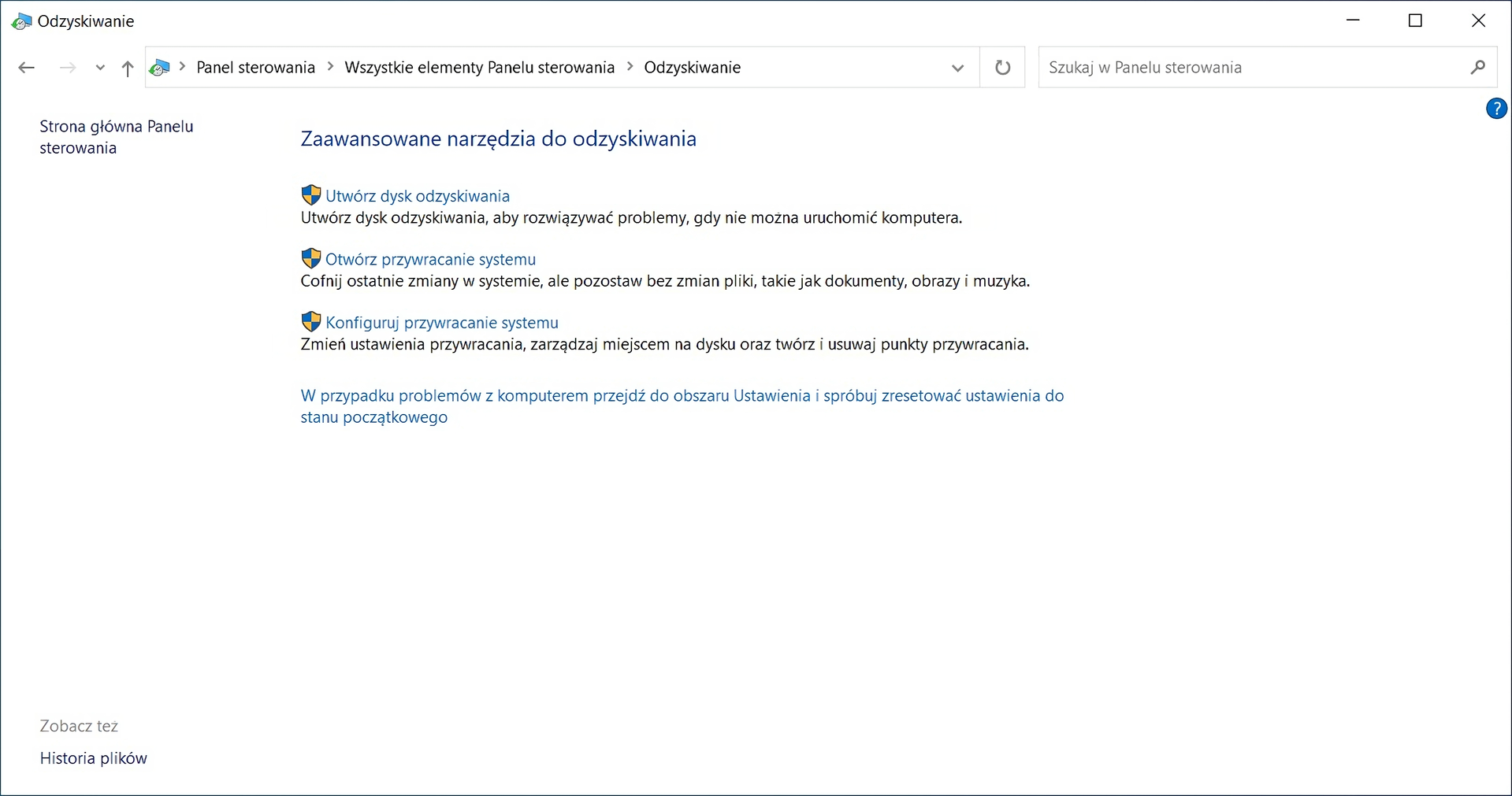 Ilustracja przedstawia okno Odzyskiwanie w panelu sterowania systemu Windows. W oknie znajduje się nagłówek Zaawansowane narzędzia do odzyskiwania, pod nim znajdują się trzy opcje razem z ich opisami, od góry: Jeden. Utwórz dysk odzyskiwania – Utwórz dysk odzyskiwania, aby rozwiązać problemy, gdy nie można uruchomić komputera, Dwa. Otwórz przywracanie systemu – Cofnij ostatnie zmiany w systemie, ale pozostaw bez zmian pliki, takie jak dokumenty, obrazy i muzyka, Trzy. Konfiguruj przywracanie systemu – Zmień ustawienia przywracania, zarządzaj miejscem na dysku oraz twórz i usuwaj punkty przywracania. Pod spodem znajduje się napis W przypadku problemów z komputerem przejdź do obszaru Ustawienia i spróbuj zresetować ustawienia do stanu początkowego.