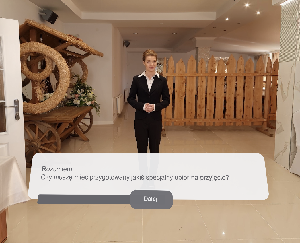 Widok przycisku "Dalej", który pozwala na poruszanie się po rzeczywistości wirtualnej VR.