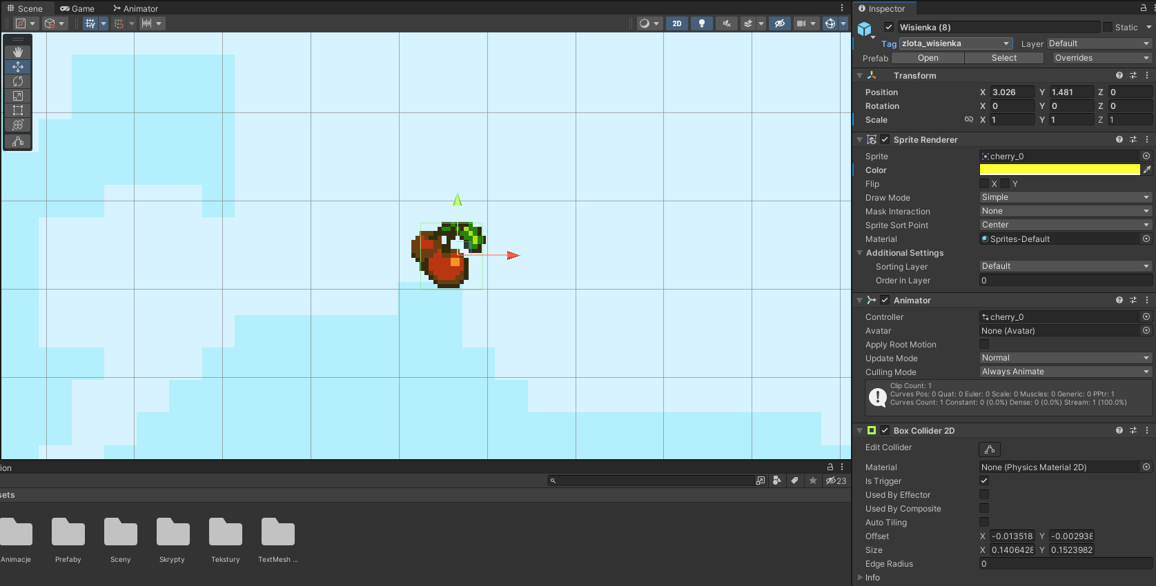 Ilustracja przedstawia ekran z grą. Na niebieskim tle w centrum są umieszczone dwie wisienki. Na nich strzałki - jedna w górę, druga w prawo. 