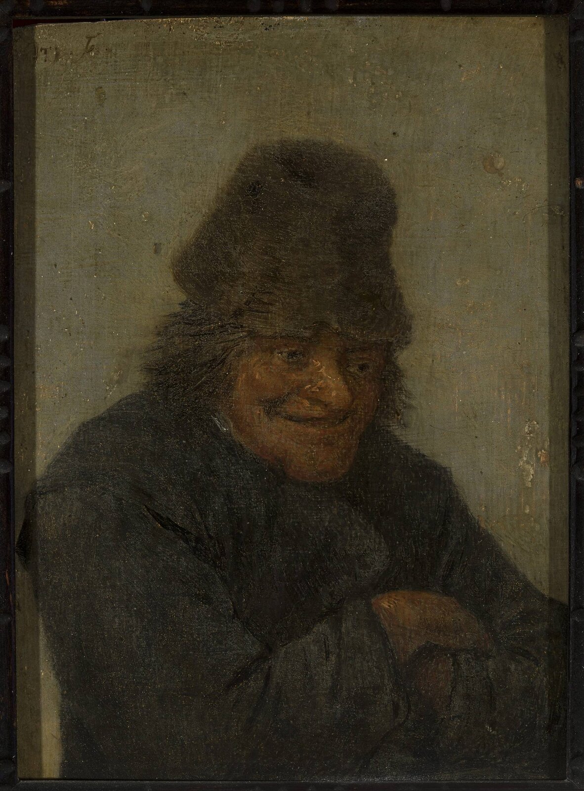 Ilustracja przedstawia obraz Davida Teniersa pt. „Popiersie śmiejącego się chłopa”. Obraz przedstawia zgarbionego, starszego mężczyznę z założonymi rękoma. Postać śmieje się. Ubrany jest w ciemny płaszcz, a na głowie ma czapkę spod, której wystają włosy. Obraz ma ciemnobrązową ramę.