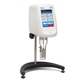 Grafika ukazuje aparat Brookfielda. Jest to urządzenie umieszczone na półokrągłym stojaku o regulowanej wysokości. Wyposażone jest w wyświetlacz oraz przyciski sterujące.