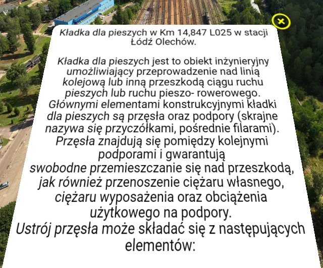 Przykładowy ekran z informacją w wycieczce. Widoczne jest białe okno z tekstem. W jego górnym prawym rogu znajduje się żółty krzyżyk.