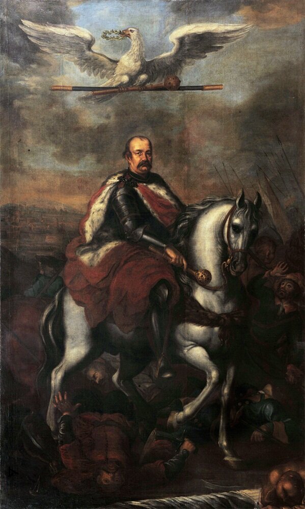 Kliknij żeby powiększyć Obraz przedstawia Jerzego Sebastiana Lubomirskiego siedzącego na białym koniu. Mężczyzna ma wąsy i łysinę z przodu. Jest ubrany w zbroję. Ma czerwony płaszcz podbity białym futrem, spięty na lewym ramieniu klamrą. W prawej ręce trzyma złotą buławę. Nad jego głową unosi się biały orzeł. Trzyma on w dziobie wieniec laurowy. Głowę odwraca w lewą stronę. Pazurami ściska laskę marszałkowską i złotą buławę. Niebo jest pokryte ciemnymi chmurami. Pod nogami konia leżą postacie martwych szlachciców.