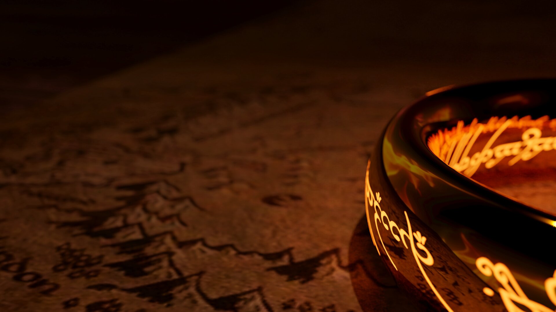 Zdjęcie przedstawia starą mapę i leżący na niej złoty pierścień z napisem w obcym języku.