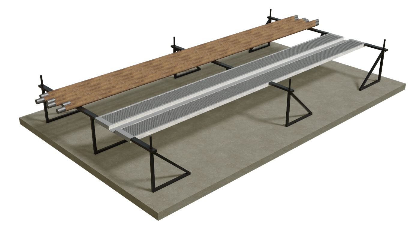 Na zdjęciu przedstawiona jest rampa służąca do prac obróbczych. Zdjęcie wykonane jest pod kątem. Podstawa jest betonowym prostopadłościanem. Na niej znajdują się trzy metalowe stelaże, każdy z nich podparty jest w trzech miejscach za pomocą metalowych prętów ułożonych w trójkąty. W górnej części konstrukcji znajduje się sześć brązowych rur. Są one ułożone obok siebie na metalowym stelażu. W górnej części każdej z rur widoczny jest srebrny fragment. Po prawej stronie rur znajdują się dwa prostokątne elementy. Są one szarego koloru. W ich środku wycięte są małe rowki na całej długości. Elementy te są połączone ze sobą za pomocą małej szarej blaszki. Elementy są wbudowane w stelaż.
