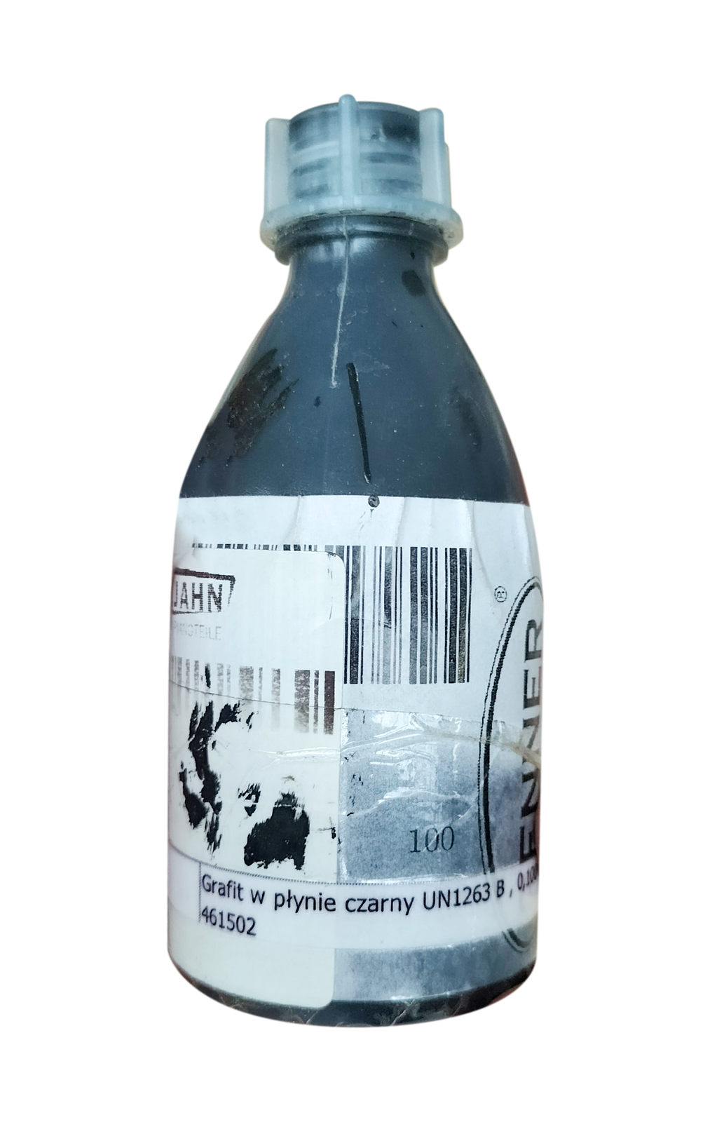 Zdjęcie przedstawia grafit stosowany do główek popychaczy, pilotów drewnianych, progów wiolinowych, mostków basowych. Widoczna jest przeźroczysta butelka z białą nakrętką, wypełniona czarną substancją. Na butelce widoczna jest biała etykieta z czarnymi napisami.