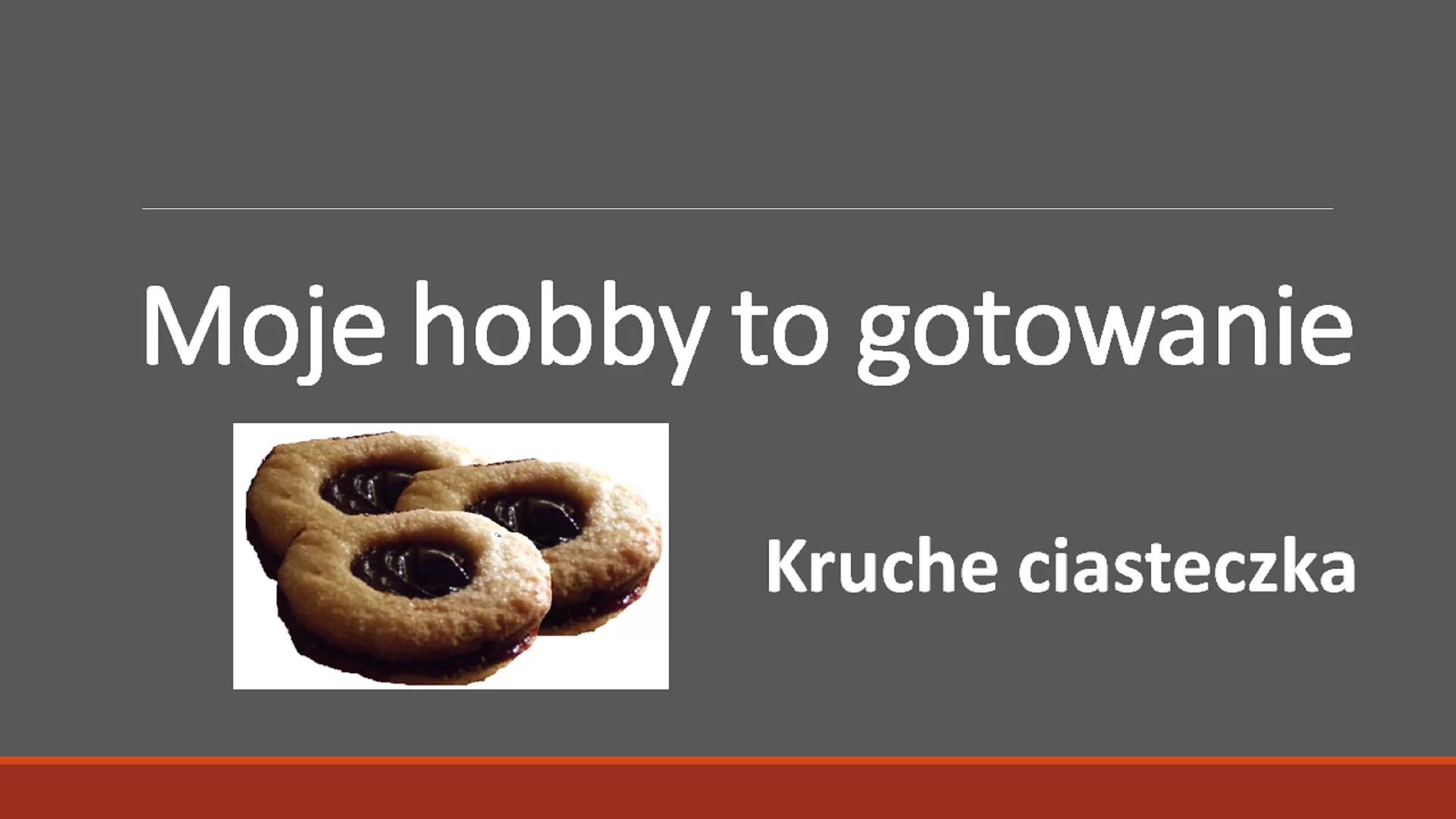 Pierwszy slajd prezentacji pod tytułem "Moje hobby to gotowanie". Tytuł ma większą czcionkę od reszty tekstu. Pod tytułem znajduje się zdjęcie trzech ciasteczek. Po prawej stronie od zdjęcia znajduje się pogrubiony tekst: "Kruche ciasteczka".