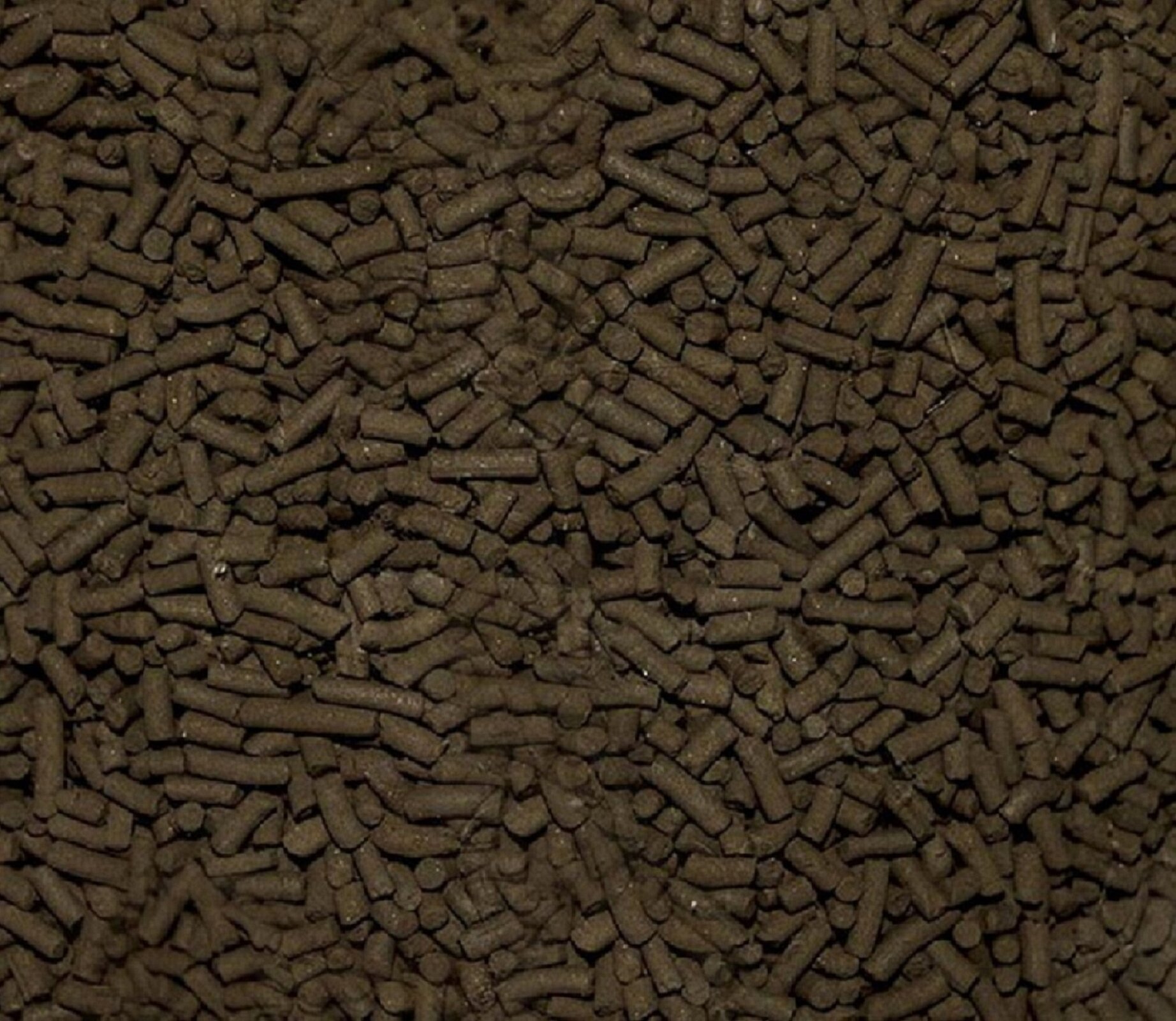 Ilustracja przedstawiająca kawałki hopkalitu. Są brązowe i mają walcowaty kształt.