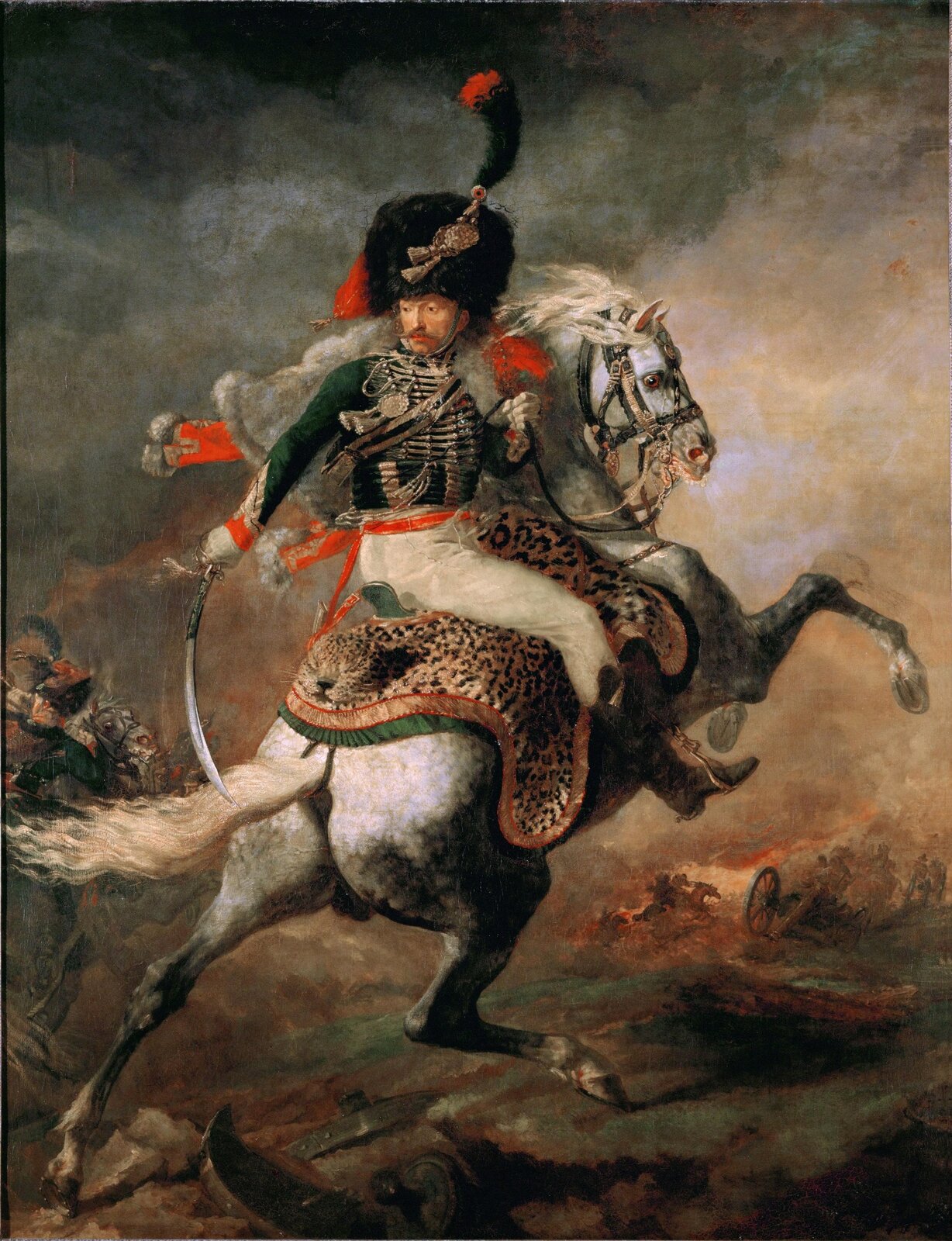 Ilustracja przedstawia obraz Théodore'a Géricault „Oficer szaserów”. Na obrazie ukazany jest żołnierz siedzący na białym koniu. Mężczyzna jest ubrany w zielono-biały mundur (zielona góra, białe spodnie). Na głowie ma dużą czarną czapę ozdobioną czarno-czerwonym piórem. W prawej ręce trzyma szablę, a w lewej lejce. Koń jest ukazany w ruchu, biegnący z dwoma przednimi nogami uniesionymi do góry.  W tle widać innych jeźdźców w trakcie walk. 
