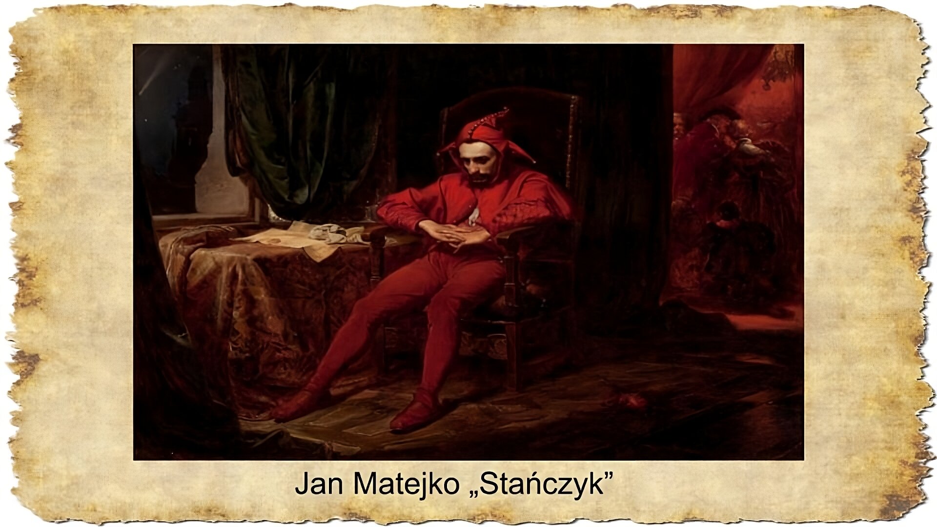 Na slajdzie znajduje się obraz przedstawiający mężczyznę przebranego w czerwony kostium błazeński z trójkątną czapeczką na głowie. Mężczyzna siedzi na krześle, twarz ma smutną, zamyśloną, ręce splecione. Po jego lewej stronie znajduje się stół przykryty ozdobnym materiałem, na którym leżą listy, dokumenty. Po prawej stronie obrazu widać w tle salę balową, w której bawi się i ucztuje dwór królowej Bony. Pod obrazem podpis: Jan Matejko "Stańczyk"