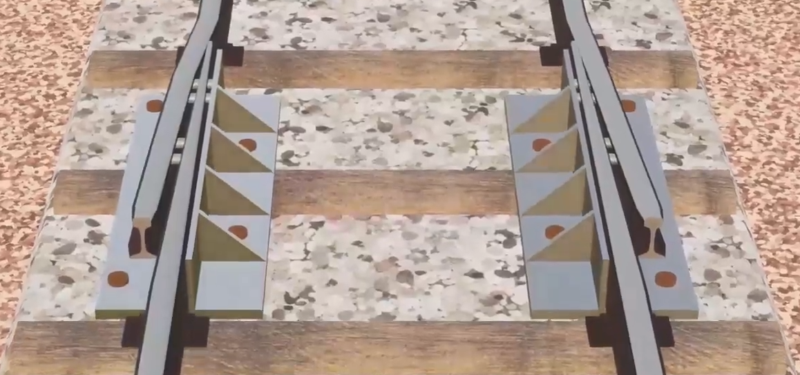 Ilustracja przedstawia przyrządy wyrównawcze toru. Są to dwa urządzenia łączące dwa końce szyn ze sobą.