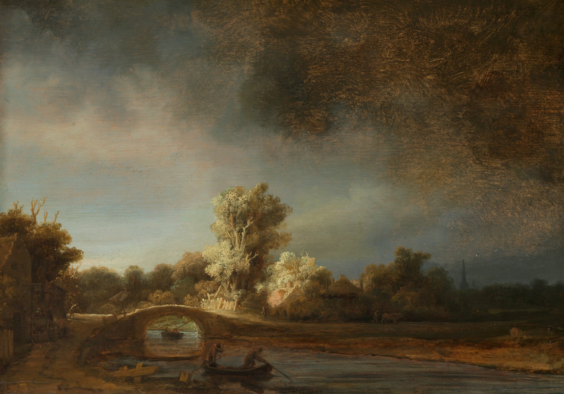 Ilustracja przedstawia obraz „Pejzaż z kamiennym mostem” autorstwa Rembrandta van Rijnna. Dzieło ukazuje krajobraz z rzeką i mostem. Nad pejzażem góruje ciężkie, mroczne niebo z ciemną chmurą po prawej stronie obrazu. Na pierwszym planie znajduje się łódka z dwoma postaciami, unosząca się na wodzie. Dalej, namalowany jest mostek, za którym wyłaniają się z mrocznego pejzażu, ciepło oświetlone zabudowania małych domków pośród drzew. Artysta przy pomocy światła buduje nastrój obrazu. Pejzaż utrzymany jest w wąskie, ciemnej tonacji kolorów. Dominują tutaj beże, ugry, zielenie i zbrudzone błękity. Dzieło wykonane jest w technice olejnej na dębowej desce.