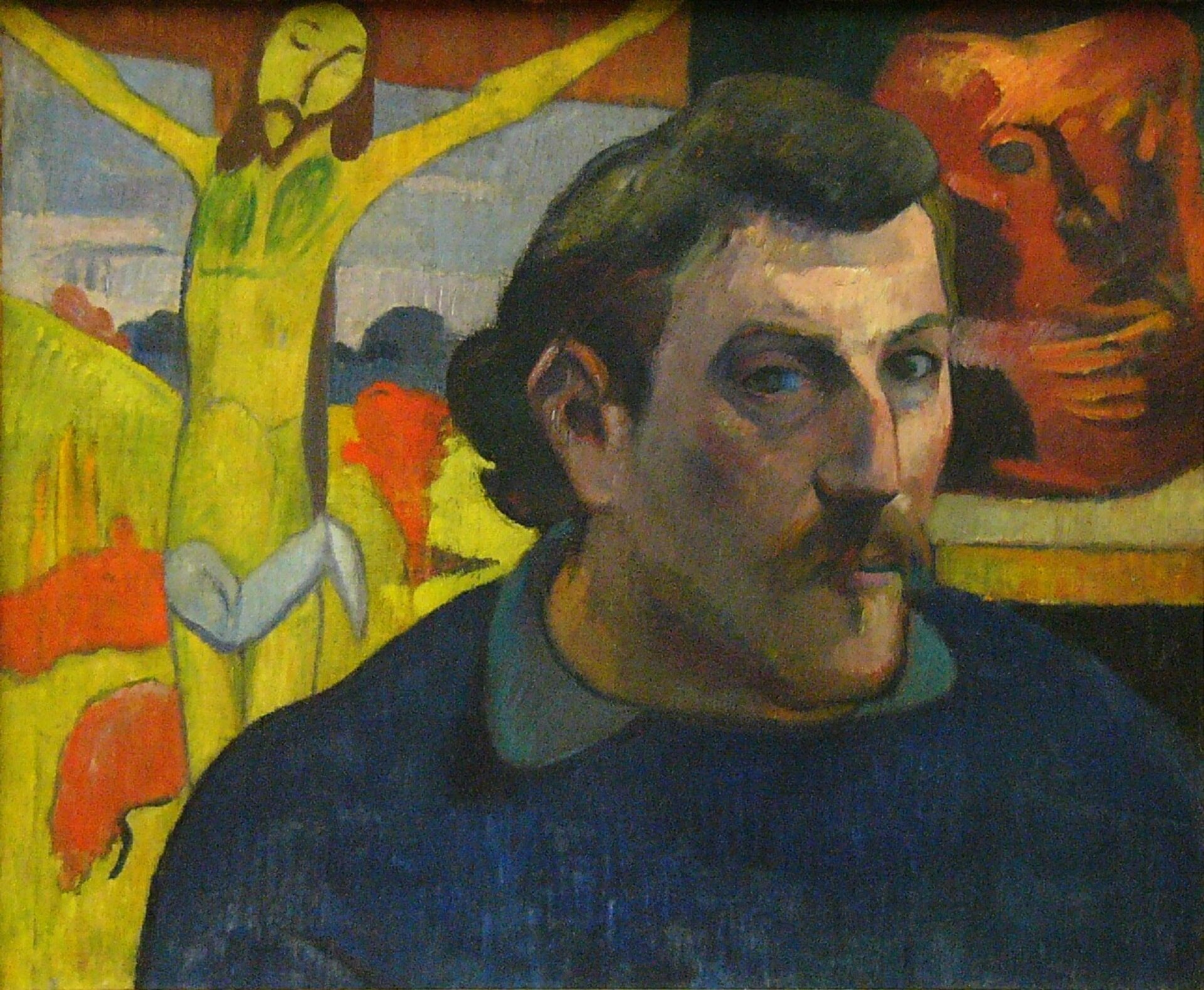 „Autoportret z żółtym Chrystusem” Paula Gauguina przedstawia zbliżenie postaci artysty. Po jego lewej stronie znajduje się fragment krzyża z Chrystusem w żółtych kolorach, a po prawej wisi na ścianie obraz. 