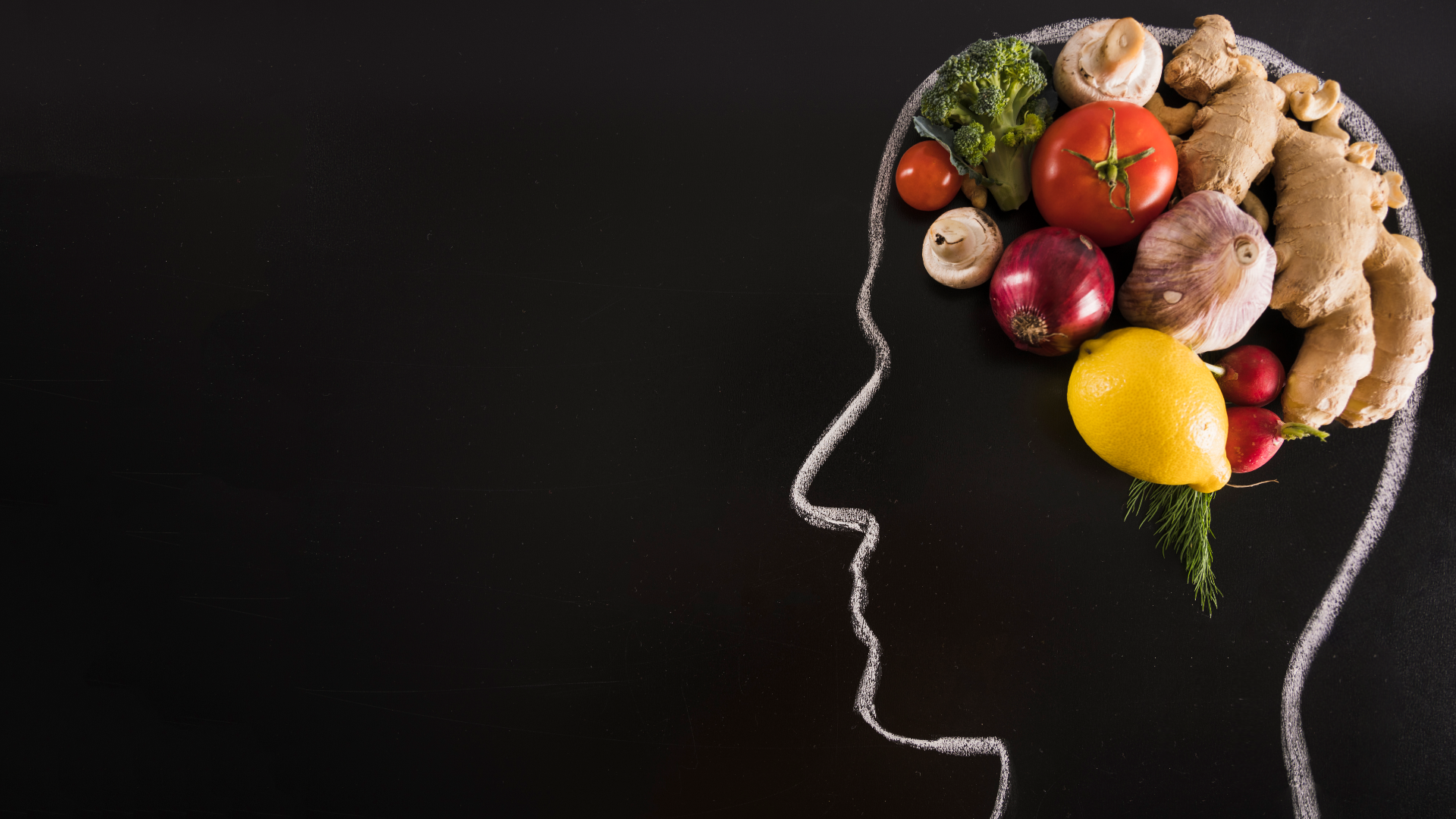 Zdjęcie przedstawia kontur twarzy w ujęciu z profilu. Górna część głowy, w miejscu mózgu wypełniona jest warzywami. Widoczny jest korzeń imbiru, główka czosnku, pomidor, cytryna, cebula, pieczarki, różyczka brokułu, rzodkiewki.