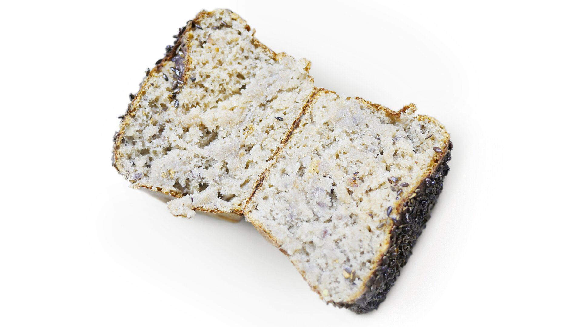 Zbliżenie przekroju kęsa ciasta żytniego pokazujące strukturę w fazie wypieku z wadą niedopieczenia