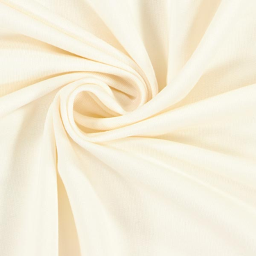 Zdjęcie przedstawia zwinięty kawałek materiału w kolorze ekri.