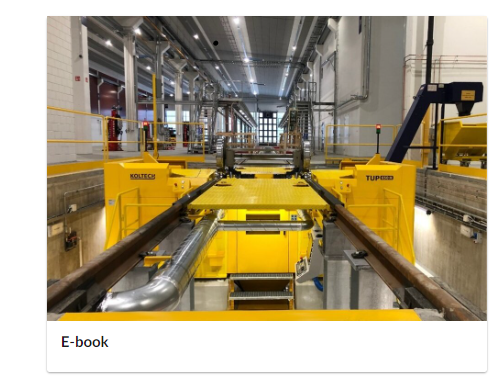 Ilustracja przedstawia ebook dołączony do lekcji. Na górze znajduje się zdjęcie instalacji znajdującej się w hali. Poniżej znajduje się napis e book.